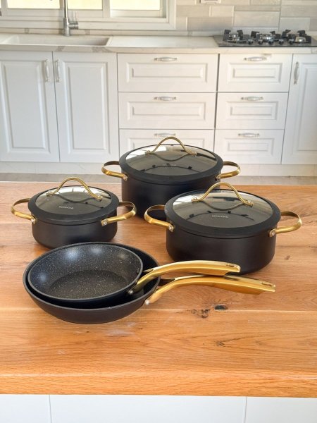 طقم طناجر يد ذهبي اسود